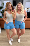 Celeste Mid Rise Shield Pocket Cutoff Shorts in Sky Blue - SwagglyLife Home & Fashion